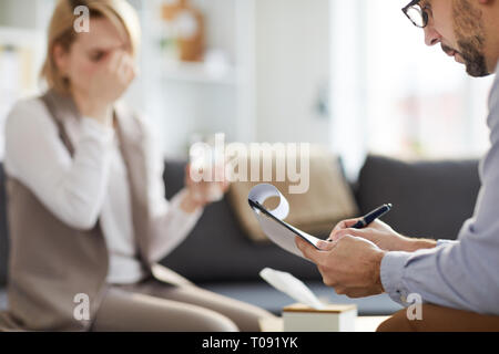 Counselor making notes Stock Photo