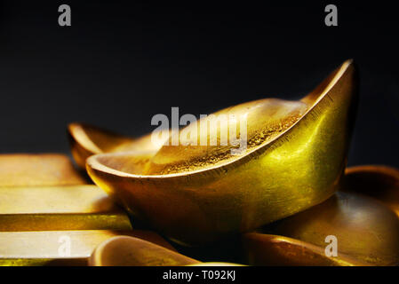 Closeup gold bar on black background Stock Photo