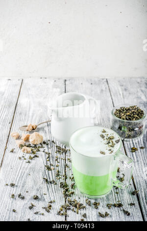 Tea latte, Hot Tokyo Fog Tea Drink with Foamed Milk and Matcha, wooden background copy space Stock Photo