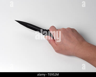 Closeup Hand Holding a Combat Knife Isolated on White Background Stock Photo