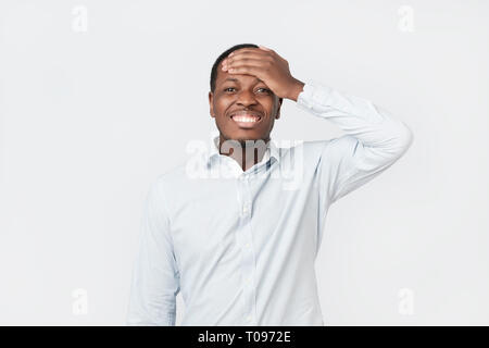 Doubtful, thoughtful african man remembering something. Young emotional man Stock Photo