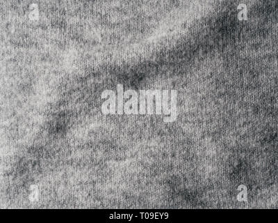 Gray sweater fabric texture. Clothes sweater background with folds Stock Photo