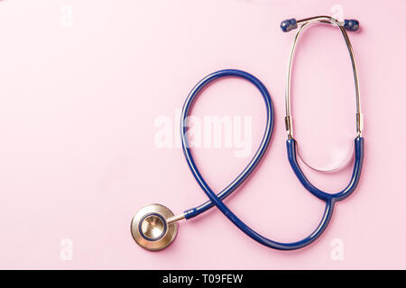 Phonendoscope on empty pink background Stock Photo