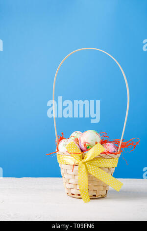 Image of basket with colorful eggs Stock Photo
