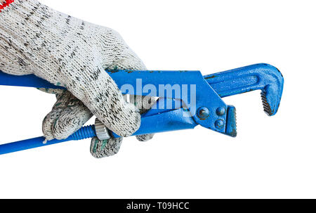 Gas adjustable wrench in a man's hand in a working glove. Locksmith tool. Stock Photo