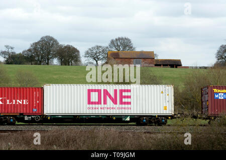 Ocean Network Express (ONE) shipping container on a freightliner train, Warwickshire, UK Stock Photo