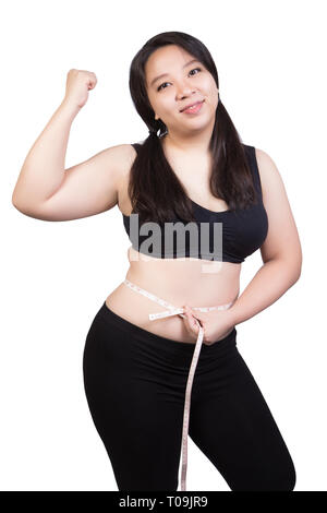 Fat Woman show obese body tight waist by measuring tape smile face isolated on white background Stock Photo