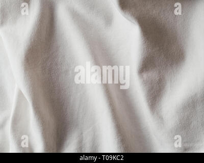 White cotton fabric texture. Clothes cotton jersey background with folds Stock Photo
