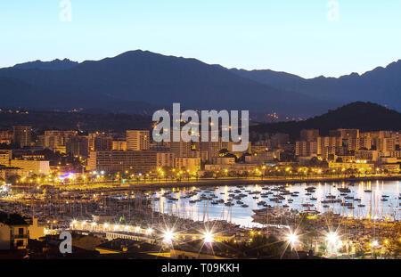 The houses of Ajaccio city and its marina at night , France, Corsica island. Stock Photo