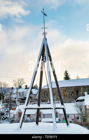 Curfew Bell and Weathervane in Leadhills village in the early morning snow. Scotlands second highest village. South Lanarkshire, Scotland Stock Photo