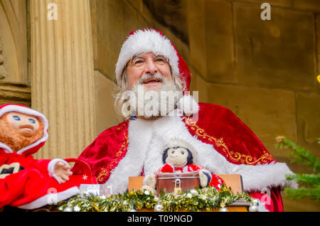 Smiling man dressed  as Santa Claus or Father Christmas (der Weihnachtsmann0 in  Rothenburg ob der Tauber,  Germany Stock Photo