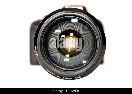 extreme close up of a lens with out of focus camera body. Stock Photo