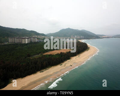 Wanning. 16th Mar, 2019. Aerial photo taken on March 16, 2019 shows the scenery of Shimei Bay of Wanning City, south China's Hainan Province. More than 76 million domestic and overseas tourists visited the island province in 2018, up 11.8 percent year on year, and tourism revenue grew 14.5 percent over the previous year to more than 95 billion yuan (14 billion U.S. dollars), data from the Hainan tourism authority showed. Credit: Sui Xiankai/Xinhua/Alamy Live News Stock Photo