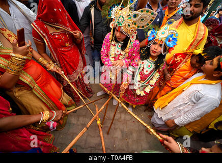 Mathura, Uttar Pradesh, India. 18th Mar, 2019. Hindu devotees are seen playing with sticks called Chaddi during the Holi Festival celebration at Gokul Dham, Mathura. This event is popularly named as Chaddimar Holi where women beat men with little sticks as per Traditional culture of Gokul, Gokul is the birth place of Hindu Lord Krishna who used to play HOLI with his friends like this way as per Local belief. Credit: Avishek Das/SOPA Images/ZUMA Wire/Alamy Live News Stock Photo