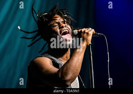 Turin, Italy. 19th Mar 2019. Kayus Bankole, singer of the Scottish band Young Fathers, performing live on stage in Torino at the Pala Alpitour, opening for the 'High as Hope' tour of Florence and the Machine Credit: Alessandro Bosio Credit: Alessandro Bosio/Alamy Live News Stock Photo
