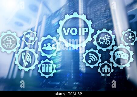 VoIP Voice over IP on the screen with a blur background of the server room. The concept of Voice over Internet Protocol Stock Photo