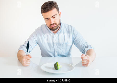 Good looking hungry man having his meal Stock Photo - Alamy