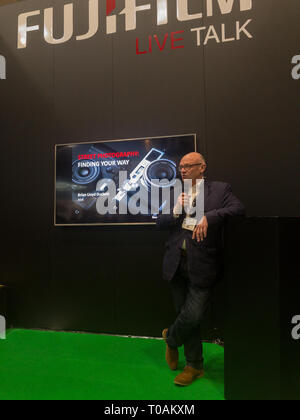 The Photography Show, Birmingham, UK, March, 17, 2019: Brian Lloyd Duckett getting ready  to present at the Fujifilm stand at The Photography Show 201 Stock Photo