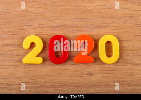 Year 2020 celebrated with multi colored numbers Stock Photo