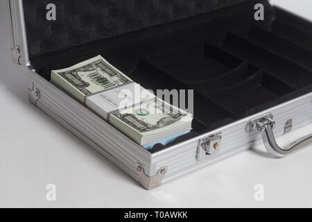 Open suitcase with one million dollars bills with tape on white background Stock Photo