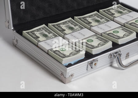 Open suitcase with one million dollars bills stacks on white background Stock Photo