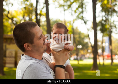 Father holding newborn little girl in hands Stock Photo