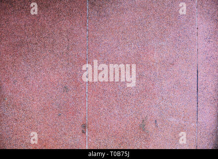 closeup old aged traditional Asian tropical red colored grunge rough textured concrete stone wall background of building, cement surface applicable fo Stock Photo