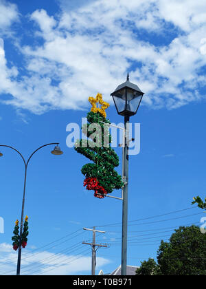 Australian Christmas street decorations attached to roadside lanterns Stock Photo
