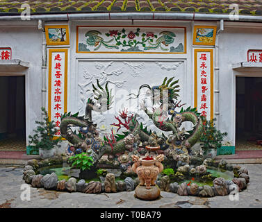 A dragon pond in the grounds of the Phuoc Kien (or Fukian, Fujian or Phuc Kien) Assembly Hall built in 1697 by Chinese merchants in the historic UNESC Stock Photo