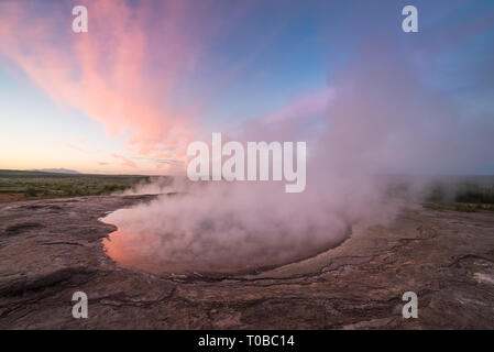 Lake in the geothermal valley. Place near the Strokkur geyser. Tourist attraction of Iceland. The Polar Day Stock Photo