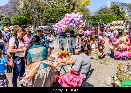 Antigua, Guatemala -  March 25, 2018: Palm Sunday street vendors by central park in town with famous Holy Week celebrations Stock Photo