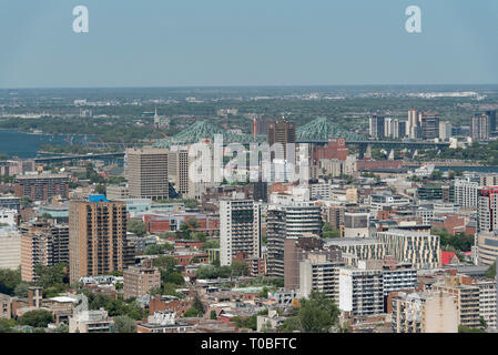 Montreal, Quebec, Canada.  View looking northeast from Mount Royal Chalet lookout in Mount Royal Park toward Jacques-Cartier Bridge and Longueuil. Stock Photo