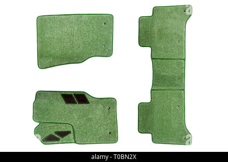 Green floor mats of carpet, velor for the front and rear seats of the car on a white isolated background, top view. Stock Photo