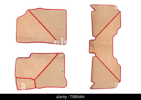 Beige-red floor mats of carpet, velor for the front and rear seats of the car on a white isolated background, top view. Stock Photo