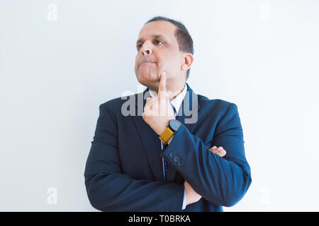 Middle age man thinking clueless about a question Stock Photo