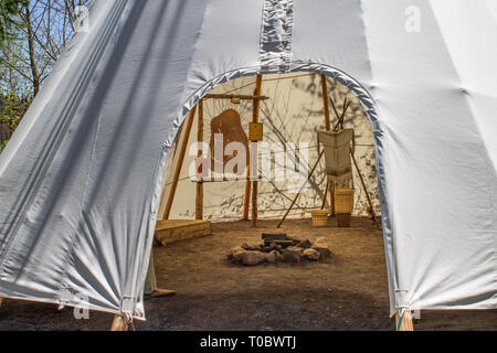 Inside a wigwam with some belongings Stock Photo