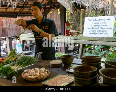 SE Asian Lao cooking lesson with Lao chef instructor and recipe for stuffed lemongrass,  Tamarind cookery school, Luang Prabang, Laos Stock Photo