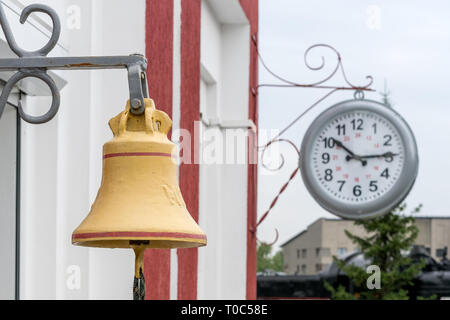Train station brass bell on the platform of the station Stock Photo