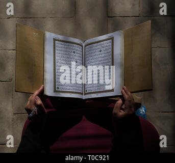 Reading quran in the mosque Stock Photo