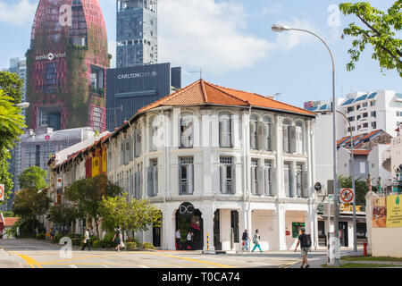 White colour, clean looking shophouses along Kreta Ayer street, background is filled with modern skyscrapers such as hotel and residential. Singapore. Stock Photo