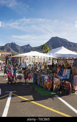 Tourist market at Costa Adeje, Tenerife with stallholders and shopping tourists. Stock Photo