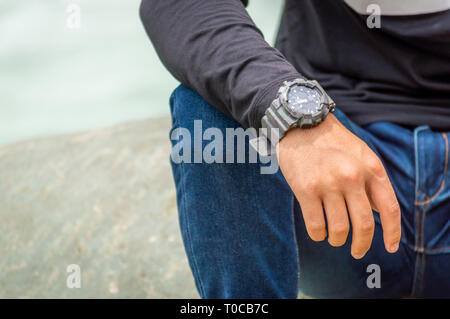 Srinagar, Jammu and Kashmir, India: Date- July 20, 2018: A person wearing a G-Shock watch and a blue jeans Stock Photo
