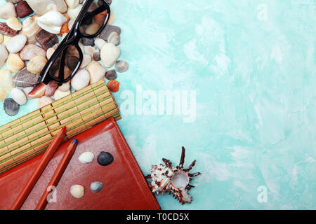 summer card with pebbles, shells and glasses Stock Photo