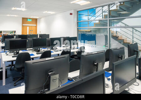 Empty classrooms at a school / college / university with desks, tables and chairs Stock Photo