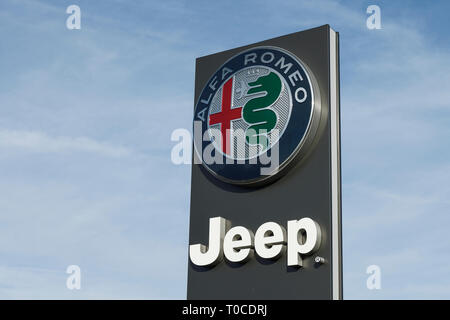 Close up detail of an Alfa Romeo and Jeep car dealership sign Stock Photo