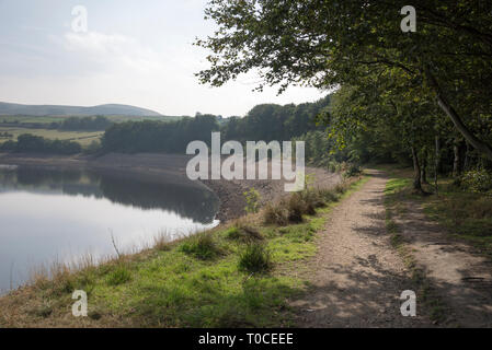 Path at the edge of Bottom's reservoir, Tintwistle, Longdendale valley, Derbyshire, England. A popular local walk. Stock Photo