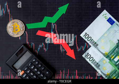 fluctuations  and forecasting of exchange rates of virtual money. Red and green arrows with golden Bitcoin ladder on black paper forex chart backgroun Stock Photo