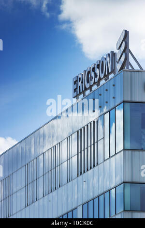 Ericsson (text) and logo signage on the roof of the company's building, Helenelund, Sweden. Stock Photo