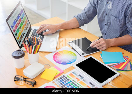 team Web designer working drawing something on graphic computer in the office or studio Stock Photo