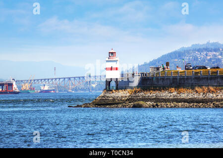 Historic Brockton Point lighthouse at Stanley Park in Vancouver, British Columbia, Canada. Named after Francis Brockton, the lighthouse has a 100-year Stock Photo